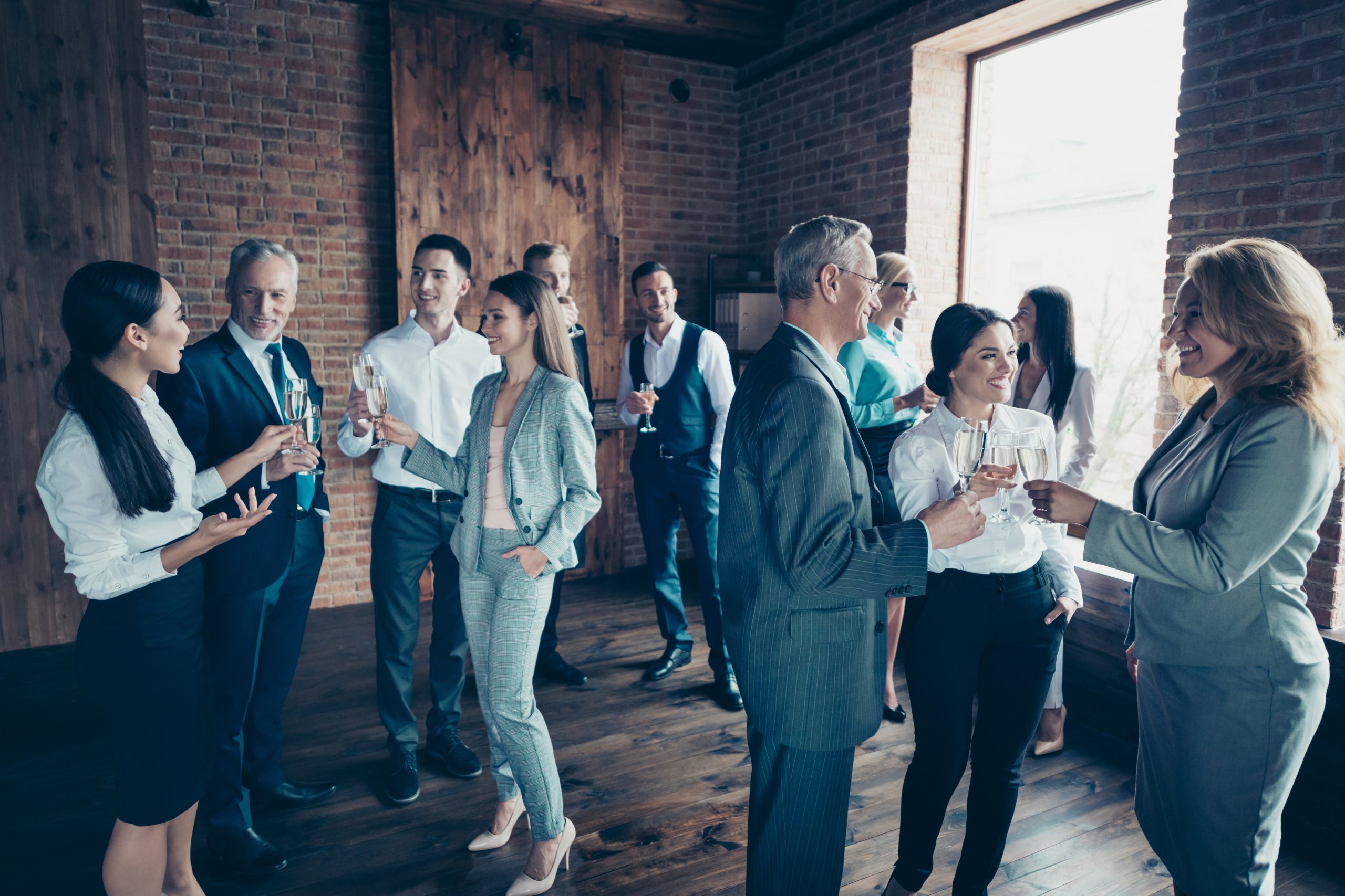 Close up photo business people different age race free leisure excited team building members gathering she her he him his golden beverage toasting best brigade friendship formal wear jackets shirts